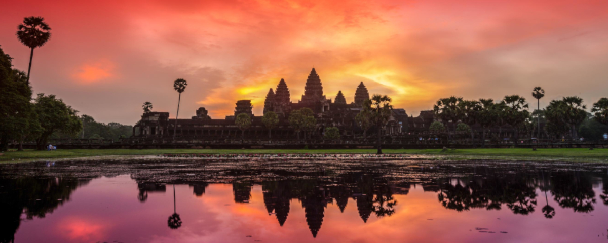 Ankor Wat, Cambodia Ankor Wat temple with orange and red sky reflected in the lake in foreground