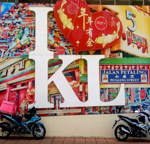 Large red sign with "I Love KL" in bold letters on a hotel in Chinatown, Kuala Lumpur.