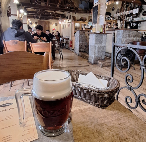 Pint of ruby craft beer served in a traditional pub setting