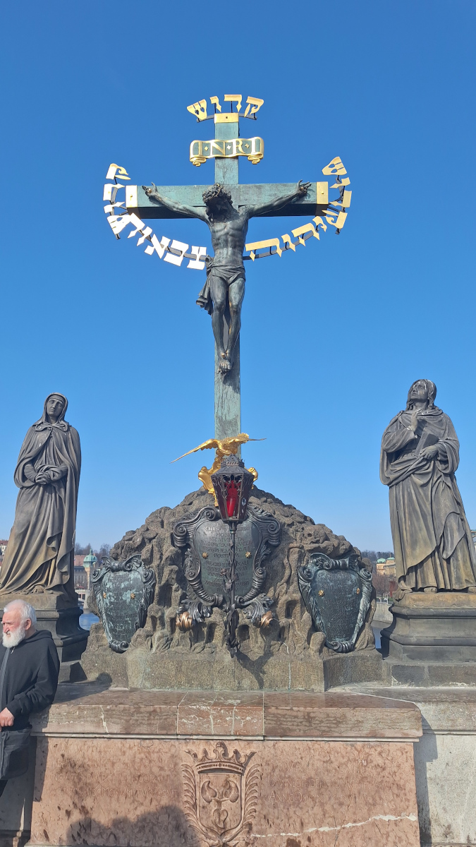 Crucifixion sculpture on Charles Bridge in Prague