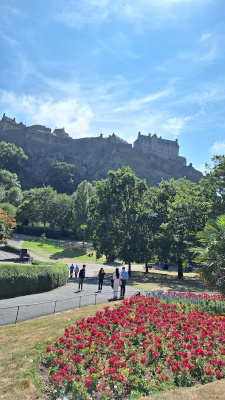 View of Edinburgh Castle from Princes Street Gardens, highlighting its historic architecture