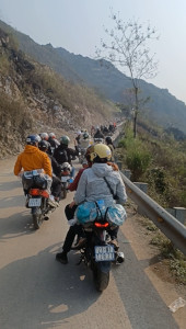 Traffic Jam on Ha Giang Loop – Landslide Impact, North Vietnam Traffic jam of motorcycles held back by a landslide on the Ha Giang Loop, North Vietnam