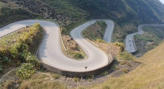 Snaking Mountain Road – Ha Giang Loop, North Vietnam Snaking road through high mountains on the Ha Giang Loop, North Vietnam