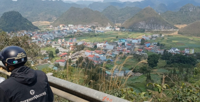 Mountain Panorama of Village – Ha Giang Loop, North Vietnam Panoramic view of a village from high in the mountains on the Ha Giang Loop, North Vietnam