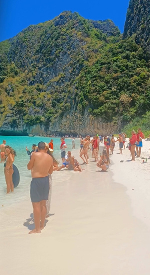 Crowded Maya Bay Beach – Tourists (Farangs), Phi Phi Leh Maya Bay beach packed with tourists (farangs), Phi Phi Leh
