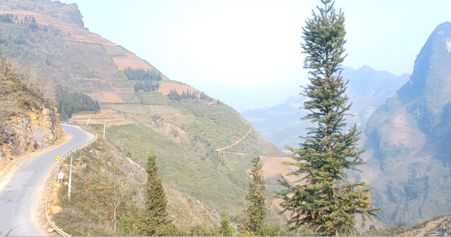 Mountain Road Near Edge – Ha Giang Loop, North Vietnam Road high in the mountains near a large drop on the Ha Giang Loop, North Vietnam