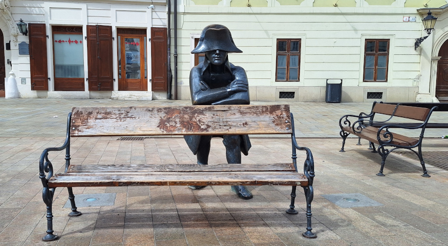 Napoleon on a Chair Napoleon on a Chair depicts the famous leader sitting casually. This statue commemorates Napoleon Bonaparte's visit to Bratislava in the early 19th century.