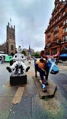 Quirky installations in the West End, featuring Oor Wullie and a Highland cow painted with a Scotland flag