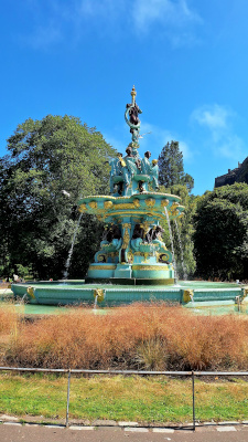 Ross Fountain in Princes Street Gardens, framed by a clear blue sky