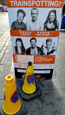 Advert sign for the Trainspotting play, promoting the iconic Scottish movie