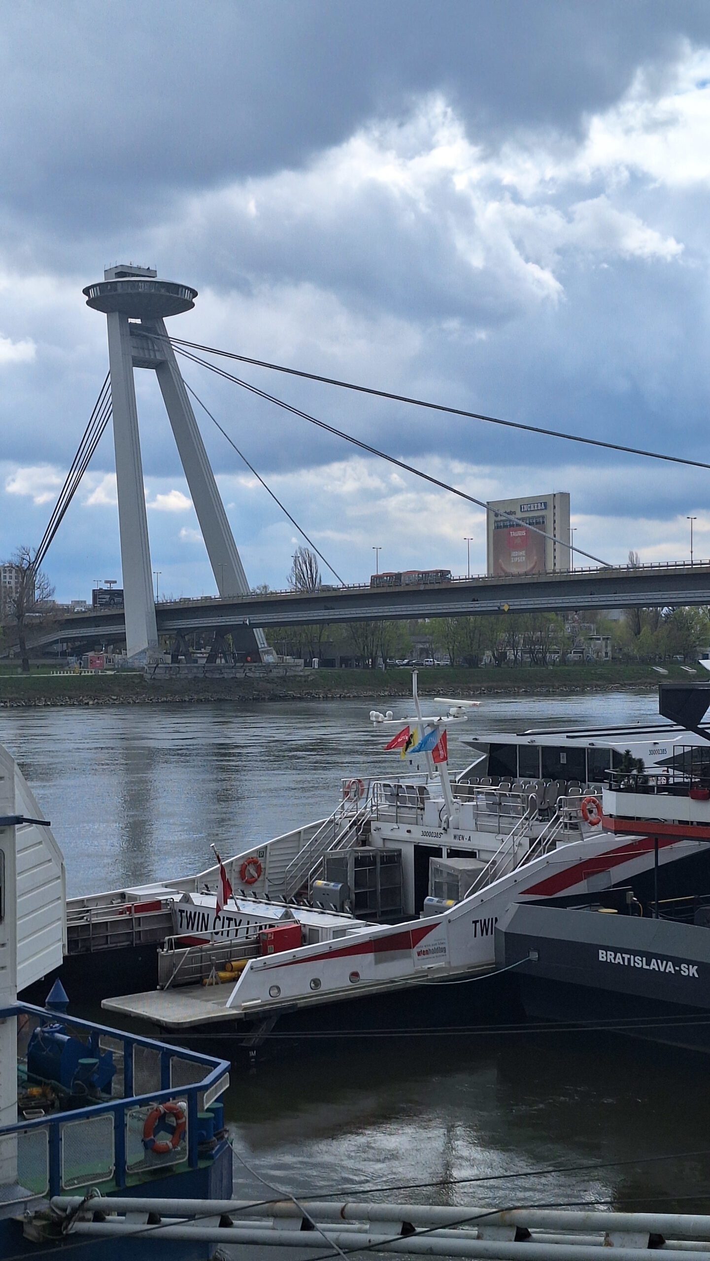 UFO Bridge and Docked Boats in Bratislava UFO Bridge in Bratislava with boats docked in the foreground