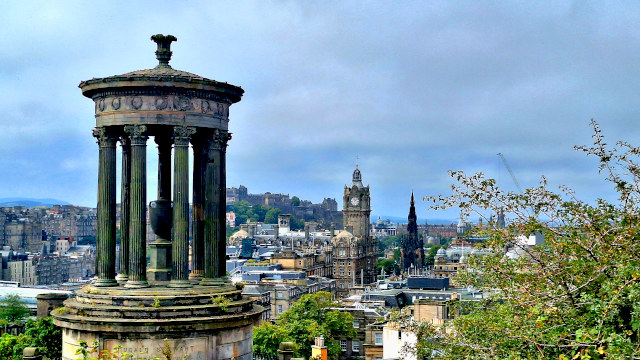 Panoramic view of Edinburgh city centre from Calton Hill, showcasing historic buildings and landscape