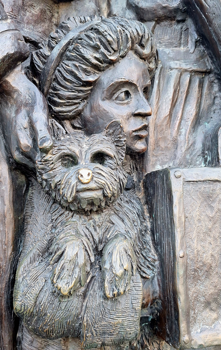 Angels Unawares Statue Close-Up – Vatican City Close-up of a dog held by a child on the Angels Unawares statue in Vatican City