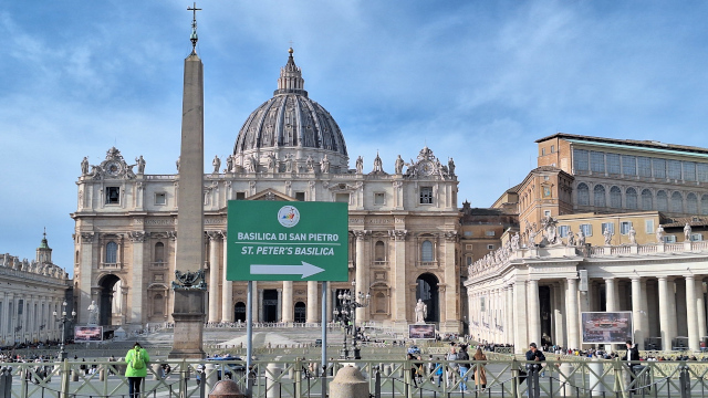 Saint Peter’s Basilica – Entrance Sign for Pilgrims, Vatican City Saint Peter's Basilica with a large sign directing pilgrims to the entrance