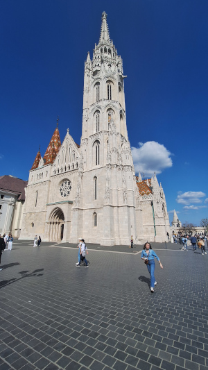 Matthias Church in Budapest with pedestrians nearby