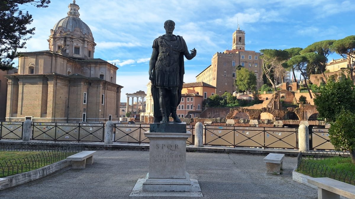 The Legacy of Julius Caesar: A Glimpse of History Near the Colosseum Statue of Julius Caesar in Rome, Italy