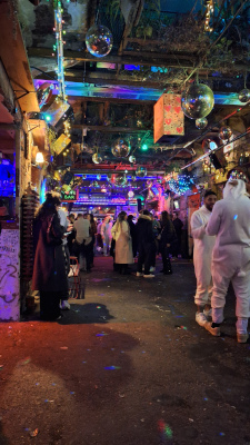Crowded interior of Simpla Kertmozi ruin bar in Budapest with tourists