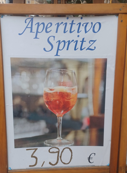 Aperitivo Spritz Street Sign – Near Colosseum, Rome Street sign advertising Aperitivo Spritz near the Colosseum in Rome