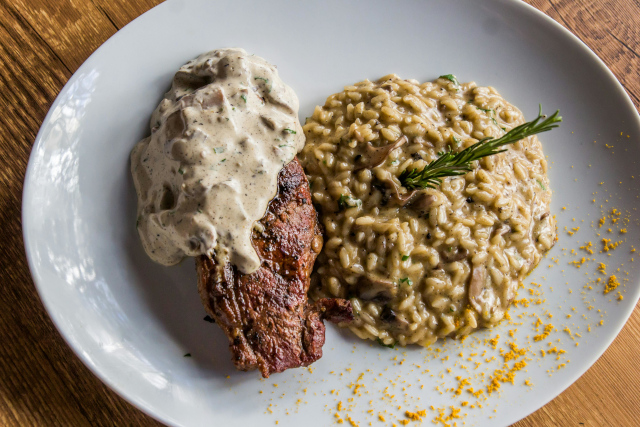 Bistecca Con Risotto – Close-Up Dish in Trastevere, Rome Close-up of Bistecca Con Risotto - Steak and Risotto in Trastevere, Rome