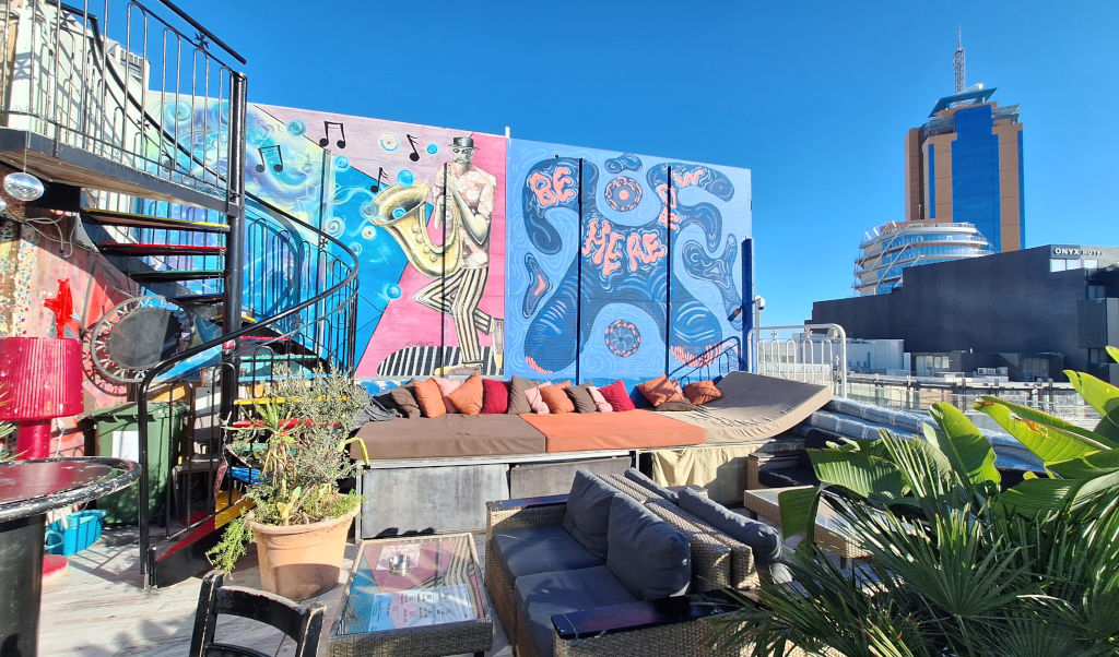 Vibrant Interior of Marco Polo Hostel Brightly colored murals and rooftop bar inside Marco Polo Hostel