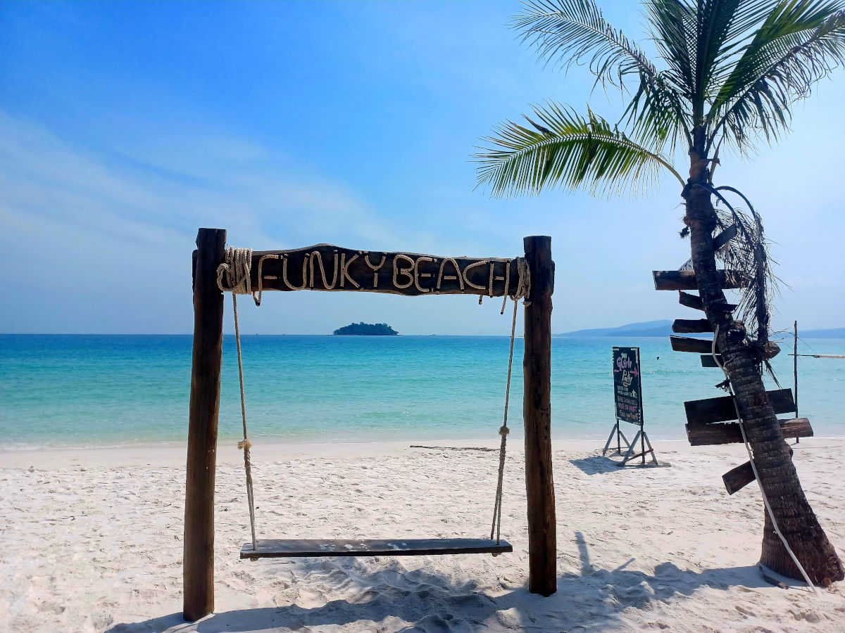 Funky Beach Swing in Koh Rong Swing and sign for Funky Beach in Koh Rong, Cambodia, surrounded by tropical scenery