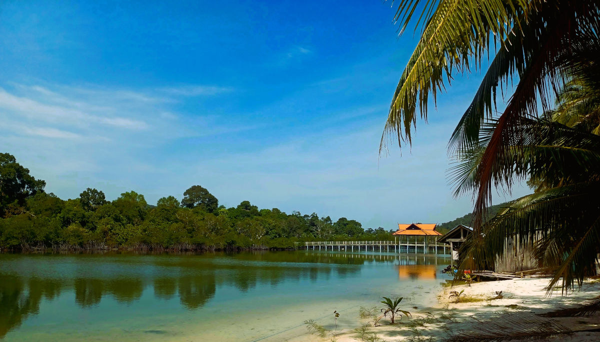 Serene Lagoon in Koh Rong Lagoon in Koh Rong surrounded by lush vegetation