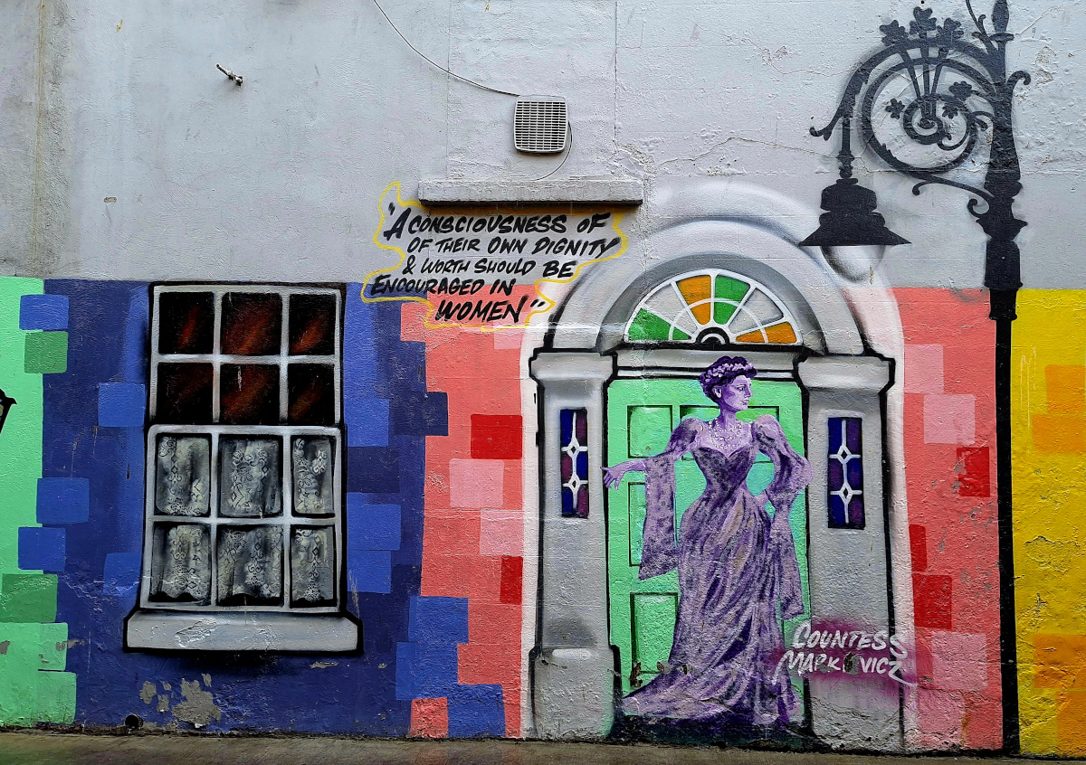 Victorian Woman Street Art in Dublin Brightly painted street art of a Victorian woman in an antique doorway in Dublin, Ireland