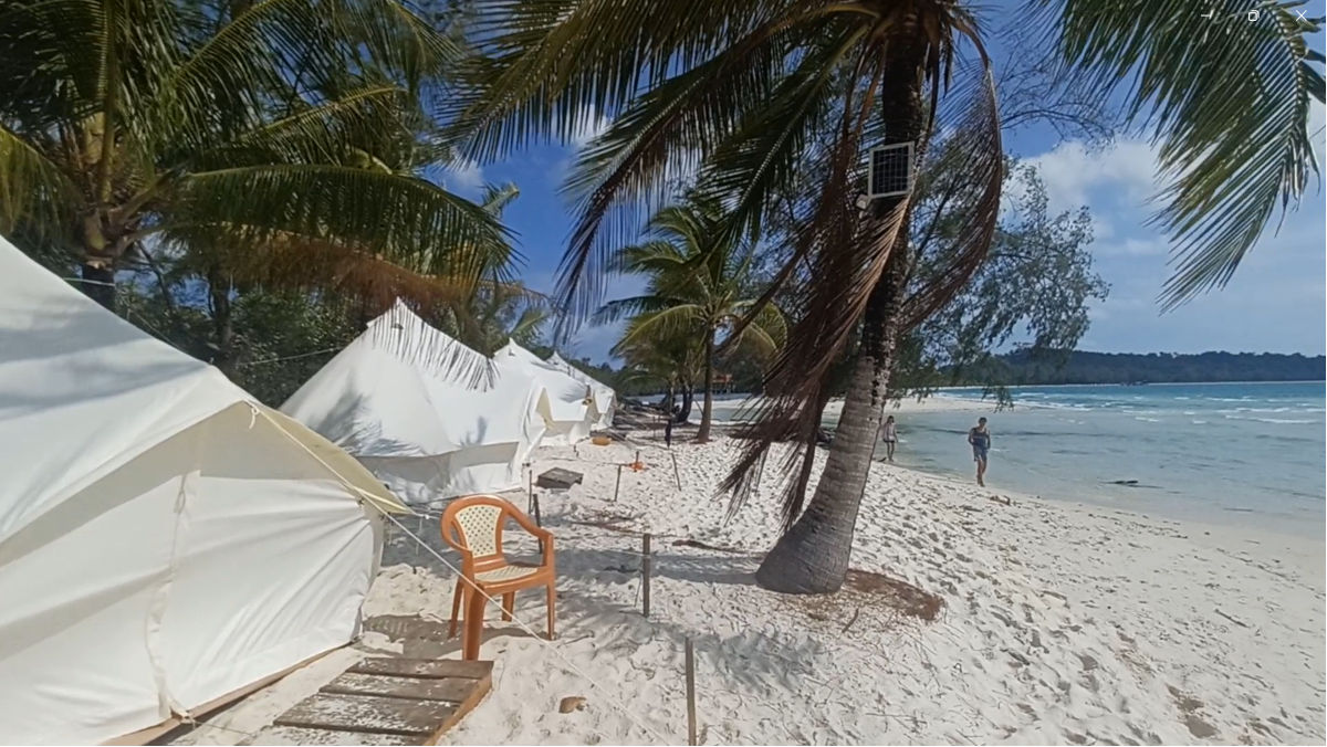 Paradise Tents on Pearl Beach, Koh Rong Tents on Pearl Beach in Koh Rong, Cambodia, featuring white powdery sand and blue skies
