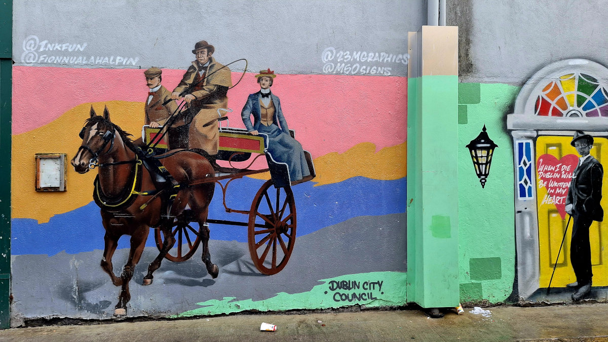 Horse-Drawn Carriage Street Art in Dublin Street art depicting a horse-drawn carriage with a man standing in a doorway in Dublin, Ireland