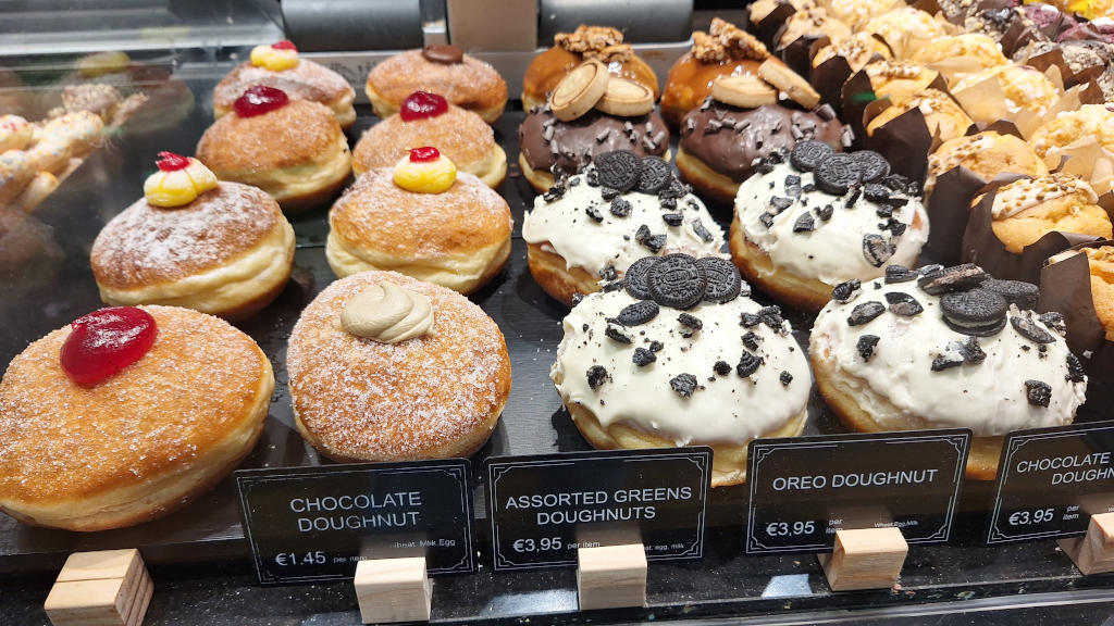 Delicious Maltese Doughnuts: Chocolate, Oreo, and Pistachio Close-up of beautiful Maltese doughnuts with chocolate, Oreo, and pistachio fillings and flavours
