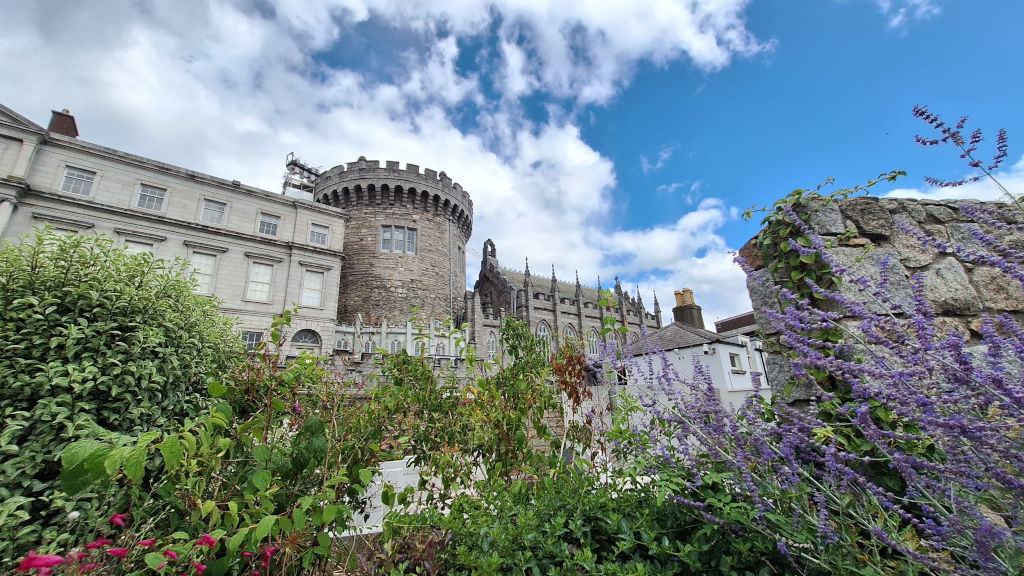 Scenic View of Dublin Castle from the Gardens Dublin Castle viewed from the gardens opposite, featuring lavender plants in the foreground and a sunny blue sky above