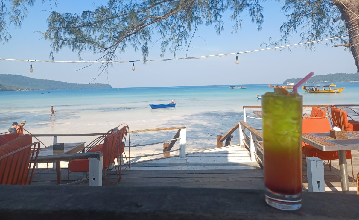 Tropical Cocktail with Koh Rong Backdrop Close-up of a cocktail with the beautiful Koh Rong landscape in the background